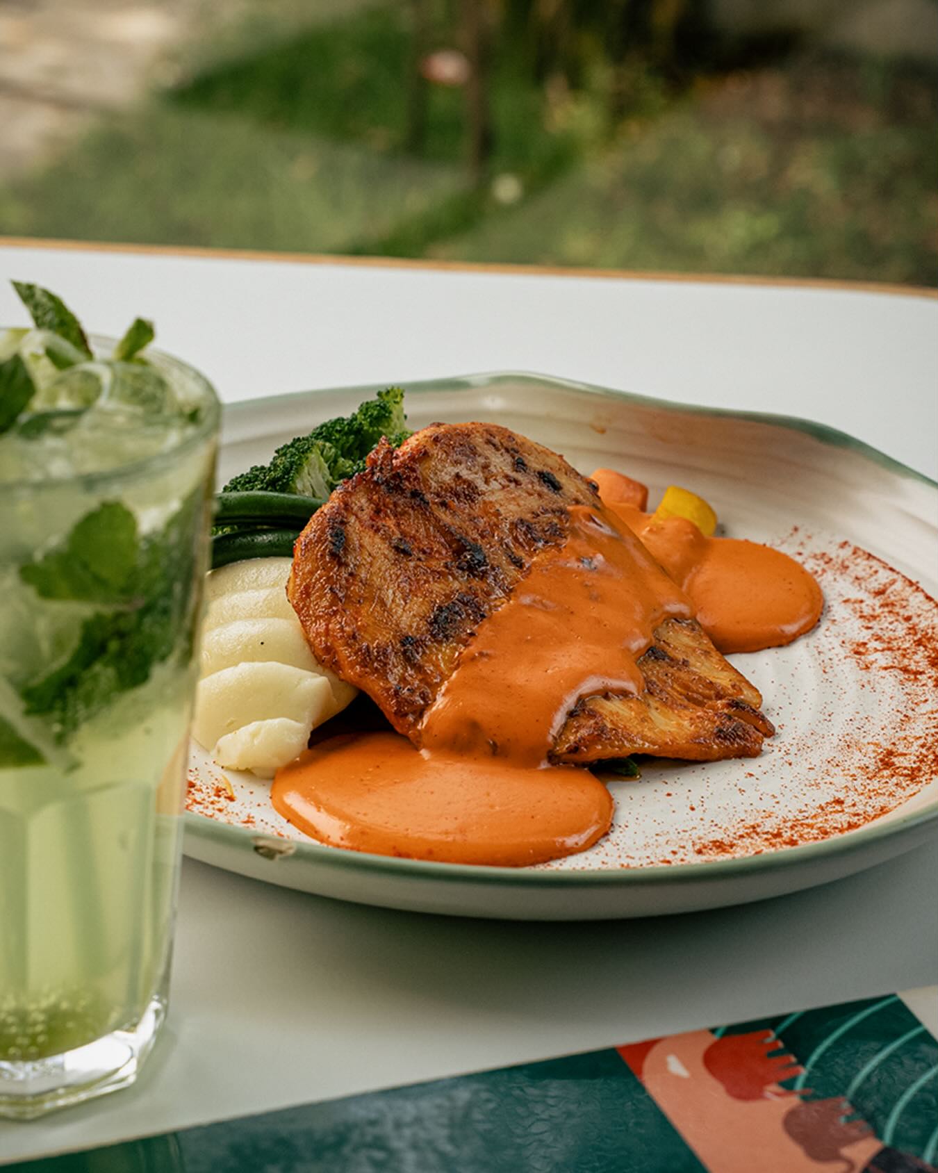 Grilled fish with paprika sauce and mojito at Cafficana